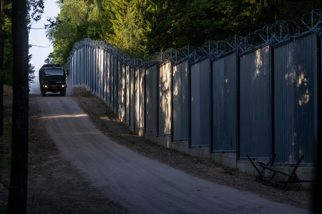 Poland shuts asylum door at Belarus border with EU backing