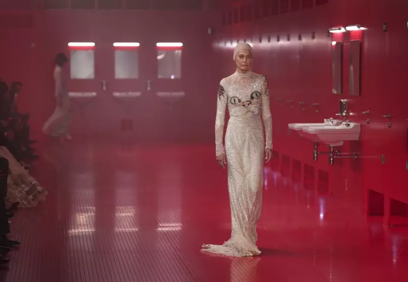 Valentino’s Michele upends high fashion by setting Paris show inside staged public toilets