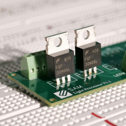 Electronic components on a circuit board illustrating computing research; not an NVIDIA processor or a facility funded by the UK research pledge.