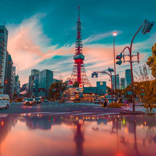 Tokyo Tower framed by urban buildings; illustrative city photograph, not a photograph of Japan's cabinet or the Kyodo opinion poll.