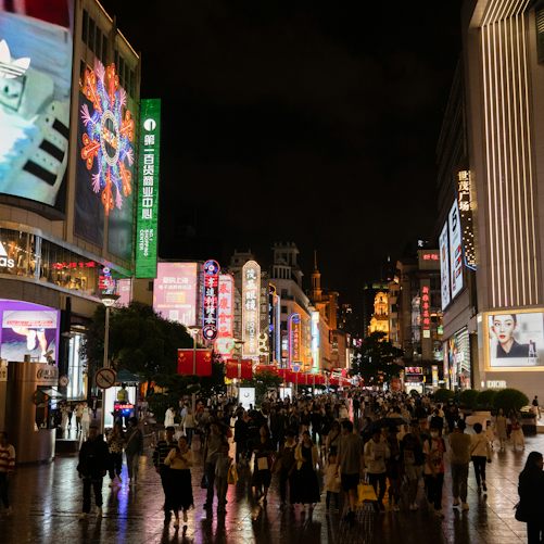 People on an urban shopping street; illustrative photograph for China's consumer economy, not the October 19 economic-data release or a measurement of spending.