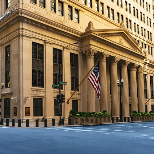 Exterior of the Federal Reserve Bank of Chicago, with an American flag.
