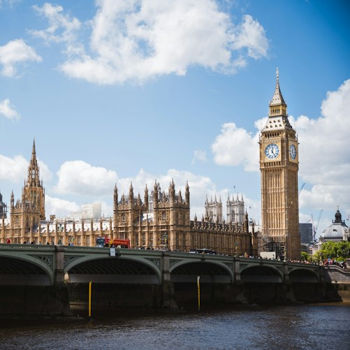 The Palace of Westminster and Elizabeth Tower beside the River Thames.